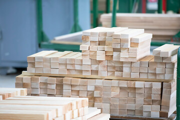 Stock pine wood log in furniture factory. Piles of wooden boards in sawmill. Warehouse for sawing...