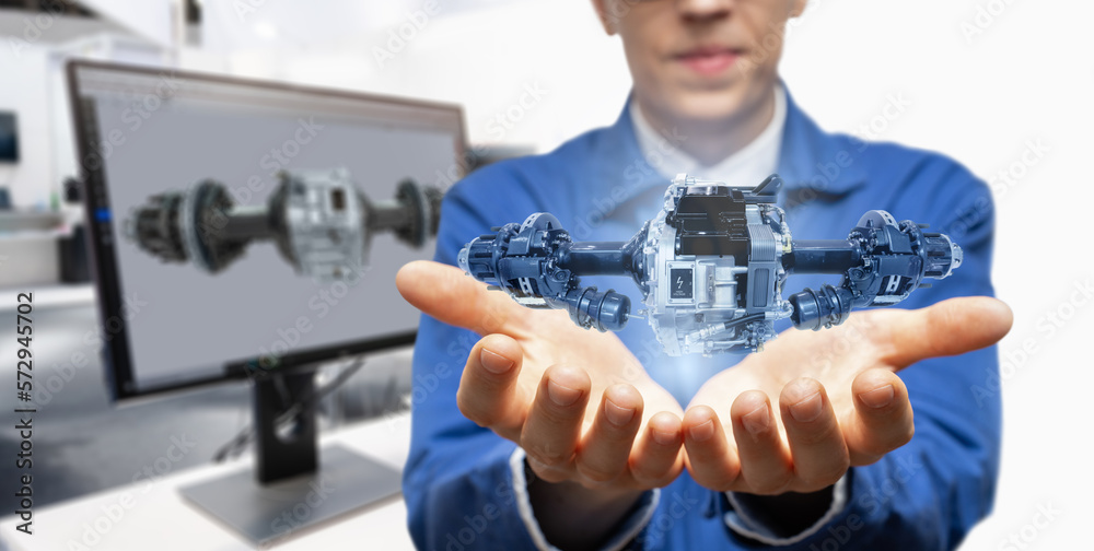 Poster Development engineer holds in his hands a model of an electric transmission created in augmented reality.