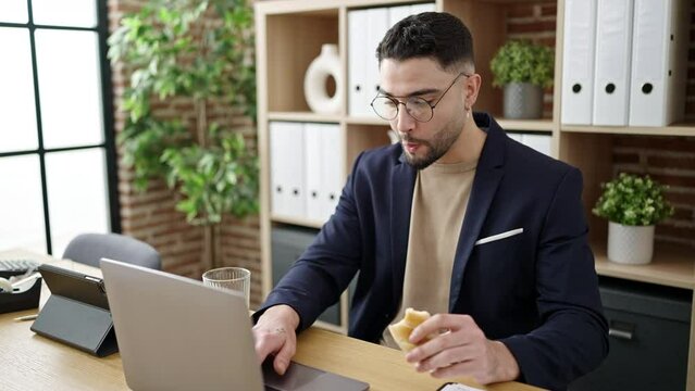 Young Arab Man Business Worker Having Breakfast Working At Office