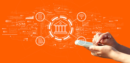 Online banking concept with person using a smartphone on a orange background