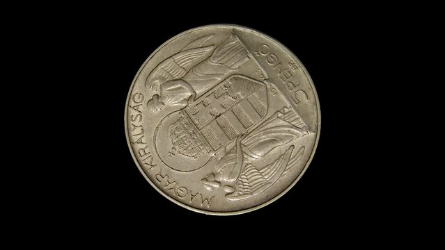 Obverse of Hungary commemorative coin 5 pengo 1943 with inscription meaning HUNGARIAN KINGDOM, isolated in black background. Close up view.