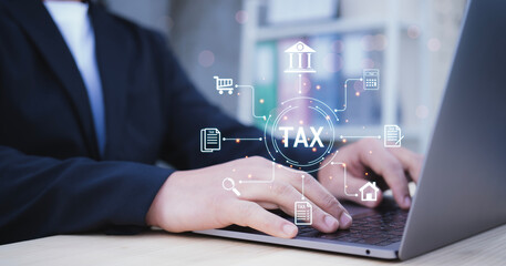 Businessman hands typing on tablet to complete Individual income tax return form online for tax payment.Government,state taxes.Data analysis,paperwork,financial research,report.Calculation tax return.