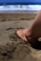 foot on the beach