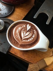 Hot chocolate in a cup on table 