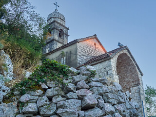 Church of Our Lady of Remedy on the slope of St. John mountain at sunrise. Kotor, Montenegro, Europe