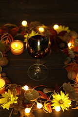 glass of red wine with autumn decoration