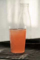 Guava drink in tumbler glass on linen cloth