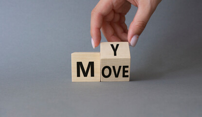 My Move symbol. Businessman hand Turnes cubes with words My Move. Beautiful grey background. Business and My Move concept. Copy space