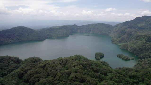 Ngozi lake in Mbeya, Tanzania. Drone view to second largest crater lake in Africa. Beautiful landscape surrounded by a bowl of high mountains.