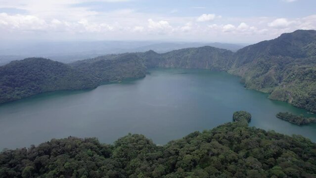 Ngozi lake in Mbeya, Tanzania. Drone view to second largest crater lake in Africa. Beautiful landscape surrounded by a bowl of high mountains.