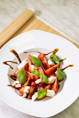 tomato salad with mozzarella, basil and balsamic cream