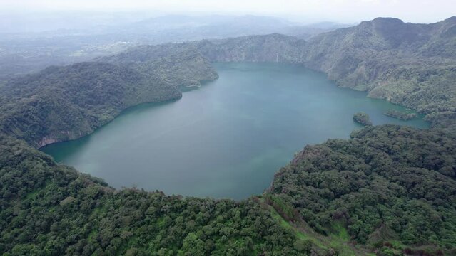 Ngozi lake in Mbeya, Tanzania. Drone view to second largest crater lake in Africa. Beautiful landscape surrounded by a bowl of high mountains.