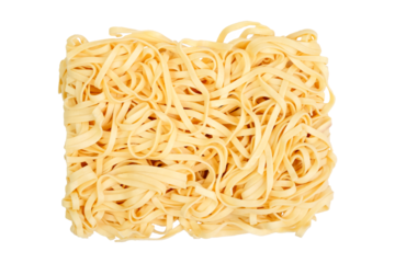 Dried raw flat egg noodles on a white background. Macro shot