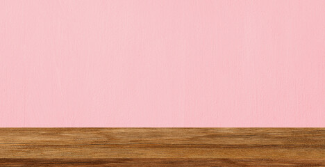 Wood table top on pink cement wall texture background