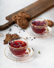 Herbal teas and cookies on a white background