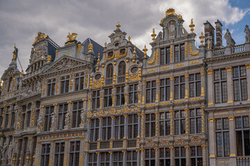 Fototapeta na wymiar Brussels Grand Place: A Golden Oasis Amidst Dark Skies