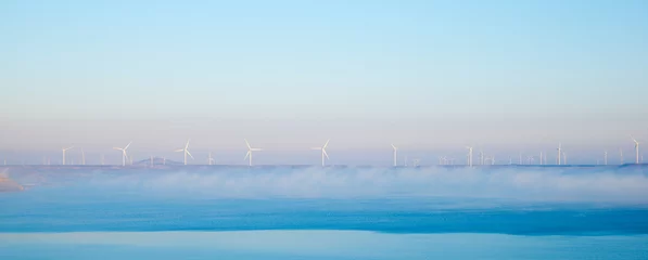 Papier Peint photo Bleu clair Wind turbine generators for ecological electricity production