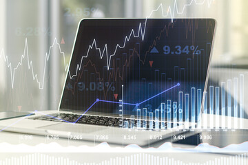 Abstract creative financial graph on modern laptop background, financial and trading concept....