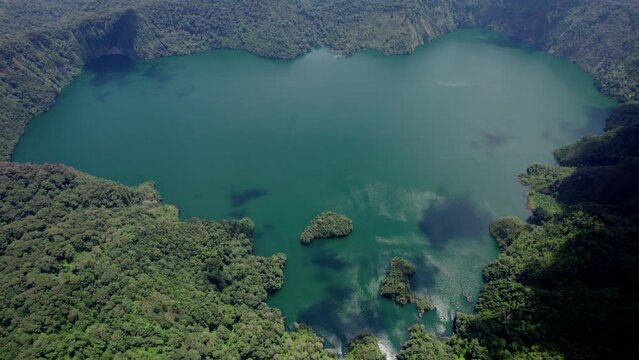 Ngozi lake in Mbeya, Tanzania. Drone view to second largest crater lake in Africa. Beautiful landscape surrounded by a bowl of high mountains.