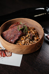 Meat with spelt. Concept of restaurant serving dishes.