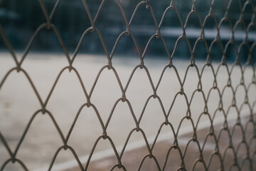 Fototapeta premium Close-up chain link fence , Sunset