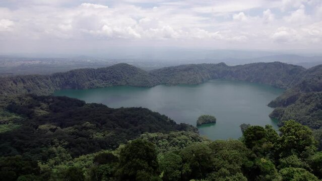 Ngozi lake in Mbeya, Tanzania. Drone view to second largest crater lake in Africa. Beautiful landscape surrounded by a bowl of high mountains.
