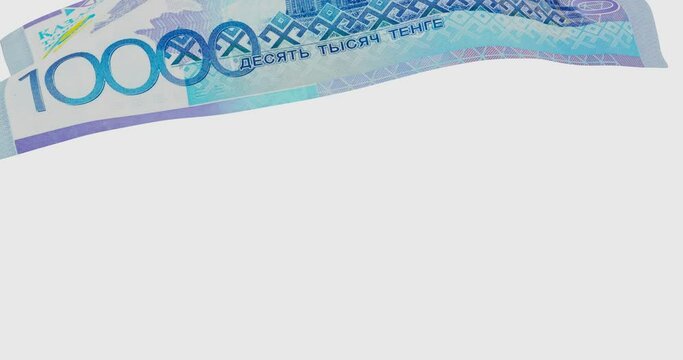Kazakhstan banknote (tenge). One banknote with a face value of 10000 Kazakhstan tenge falls on an invisible surface. 4K footage video