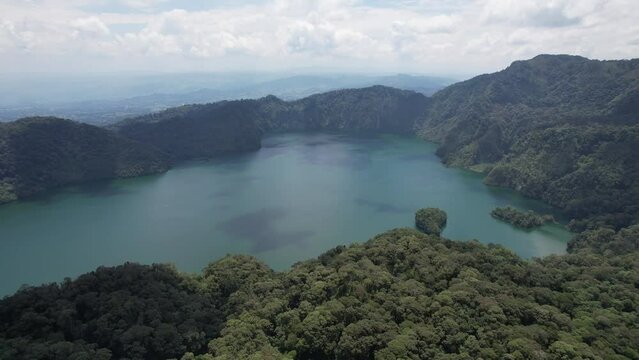 Ngozi lake in Mbeya, Tanzania. Drone view to second largest crater lake in Africa. Beautiful landscape surrounded by a bowl of high mountains.