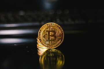 Golden coins with bitcoin symbol and black backround