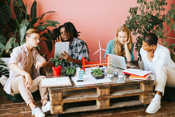 diversity and international group of young people students working on eco friendly urban city project with renewable energy, sustainable development using alternative energy sources, botanical studio