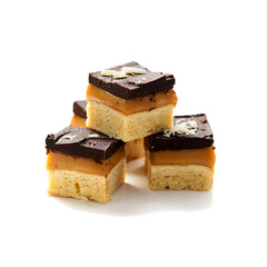 Millionaire's shortbread with chocolate and caramel isolated on white