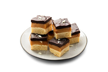 Millionaire's shortbread with chocolate and caramel isolated on white