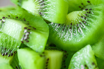 Fototapeta na wymiar Kiwi fruit green sliced and piled in pile, selective focus