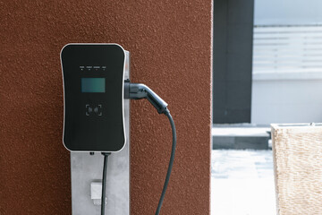 Progressive green energy-powered charging station concept for electric vehicle connected to home...