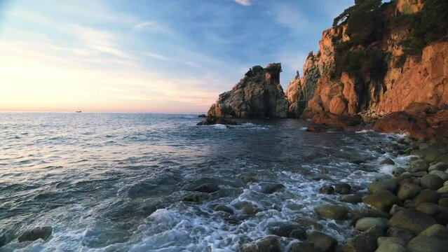 Sunrise on the coastline of the sea (Costa Brava, Spain)