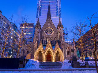 The Christ Church Cathedral in Montreal is illuminated to attract shoppers because it is located above the Promenades de la Cathédrale shopping centre.