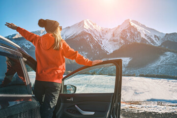 Woman traveling exploring, enjoying the view of the mountains, landscape, lifestyle concept winter...