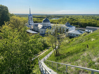 Panorama of summer landscape with ortadox chirch with clear sky view from mountain