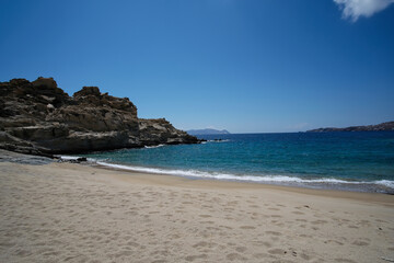 Fototapeta na wymiar The beautiful turquoise dream sandy beach of Sapounohoma in Ios Greece