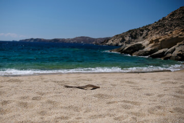The beautiful turquoise sandy beach of Sapounohoma in Ios Greece