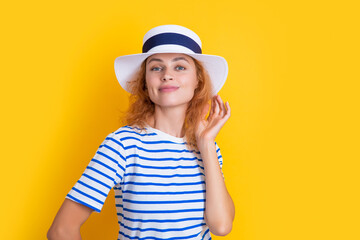 Fototapeta premium woman summer portrait isolated on yellow background. portrait of woman in summer hat.
