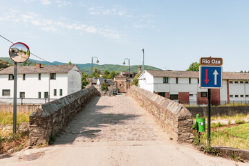 Fototapeta na wymiar medieval bridge over Oza river at Toral de Merayo, municipality of Ponferrada, El Bierzo, province of León, Spain - June 2022