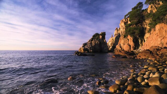 Beautiful sunrise on the coastline of the Mediterranean Sea (Cala S'Agulla, Costa Brava - Spain)