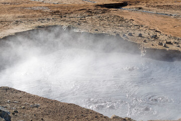 Fototapeta na wymiar Hverir geothermal area in Iceland. Popular tourist area with mud pots and smoking vents.