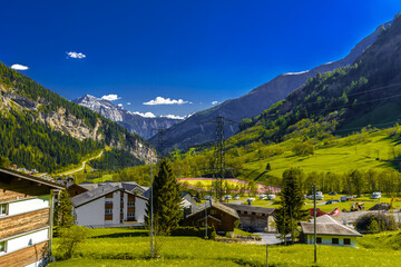 Mountains and chalet in swiss village in Alps, Leukerbad, Leuk, Visp, Wallis, Valais Switzerland