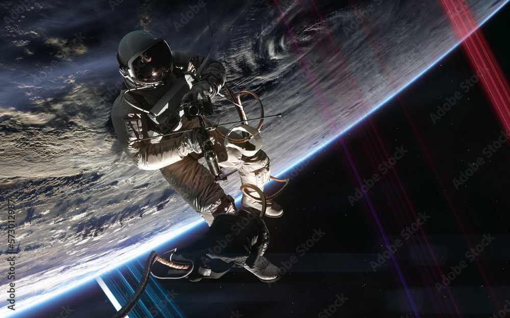 Wall mural astronaut in outer space orbiting distant planet. science fiction. elements of this image furnished 