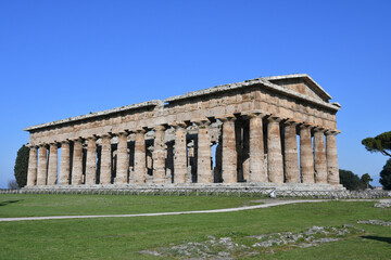 Fototapeta na wymiar Architecture of an ancient Greek temple in the archaeological park of Paestum in Campania, Italy.