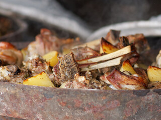 zum zeri lamb cooked in a really big container called testo a tasty specially of tuscany