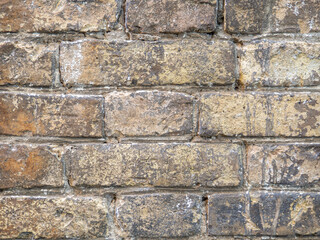 Wall of the old church. Background from brown bricks. Stone pattern.  Old brick laying
