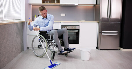 Person With Disabilty Cleaning Kitchen Floor